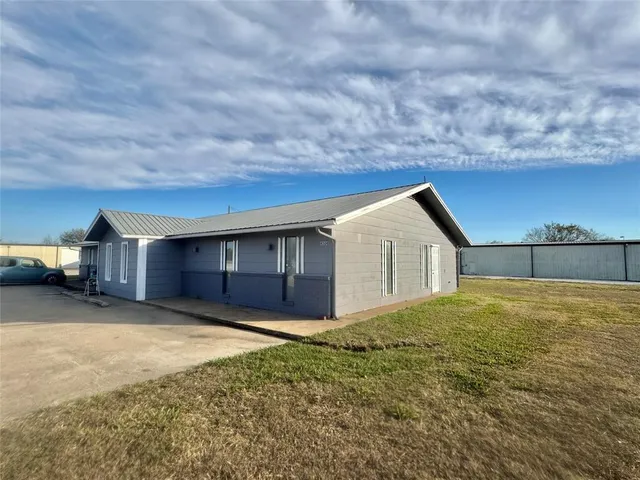a house view with a backyard space
