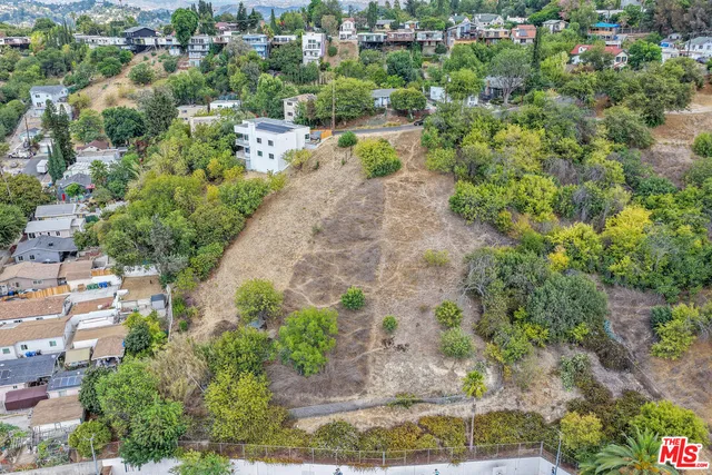 an aerial view of a city with lots of residential buildings