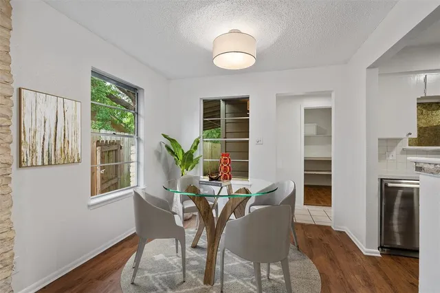 a dining room with furniture window wooden floor and a livingroom