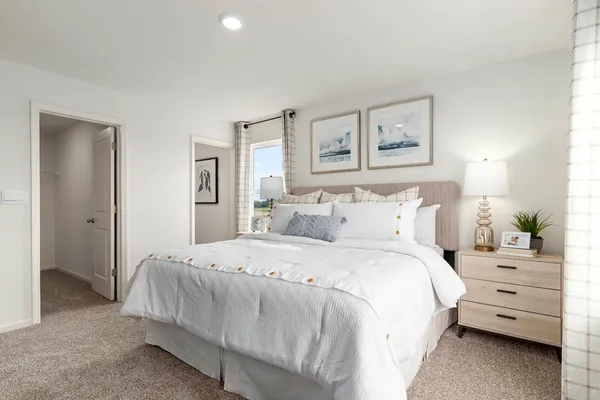 a bedroom with furniture and a window