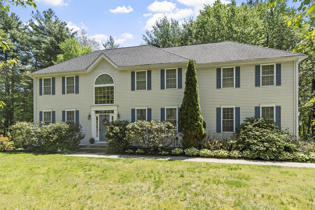 4 Forest Street Georgetown, MA 01833 - Photo 1 of 37 a front view of a house with a yard