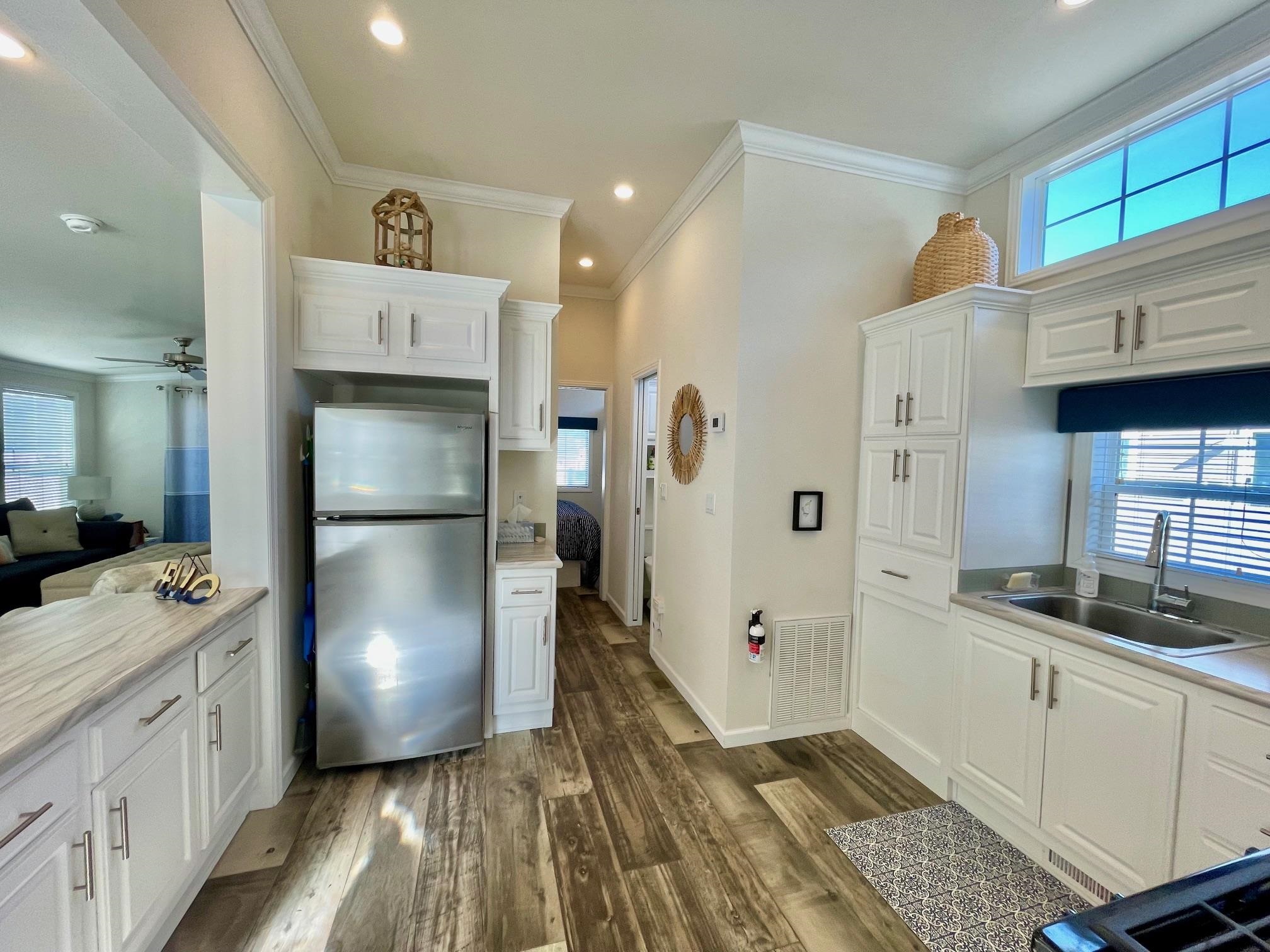4100 Rte 9 South, Unit 84 Rio Grande, NJ 08242 - Photo 15 of 22 a kitchen with a refrigerator and a sink
