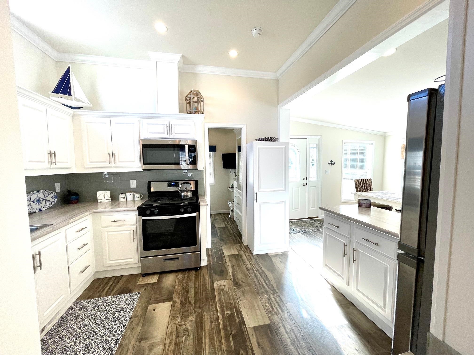 4100 Rte 9 South, Unit 84 Rio Grande, NJ 08242 - Photo 16 of 22 a kitchen with stainless steel appliances a stove a sink and a refrigerator