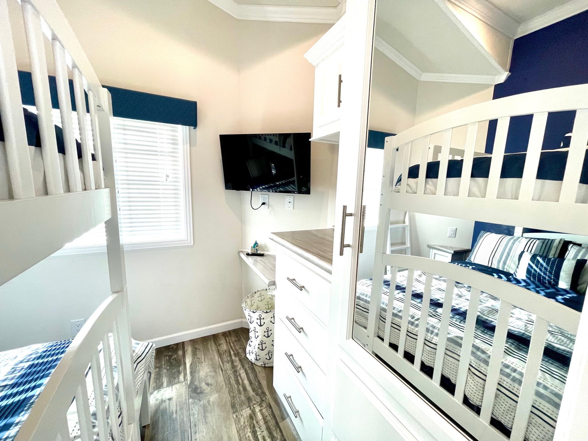 4100 Rte 9 South, Unit 84 Rio Grande, NJ 08242 - Photo 18 of 22 a view of a bedroom with a bed and flat screen tv