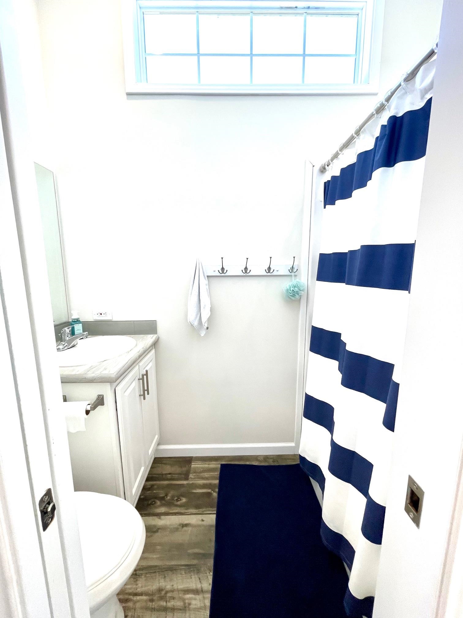 4100 Rte 9 South, Unit 84 Rio Grande, NJ 08242 - Photo 21 of 22 a bathroom with a sink a toilet a shower and mirror