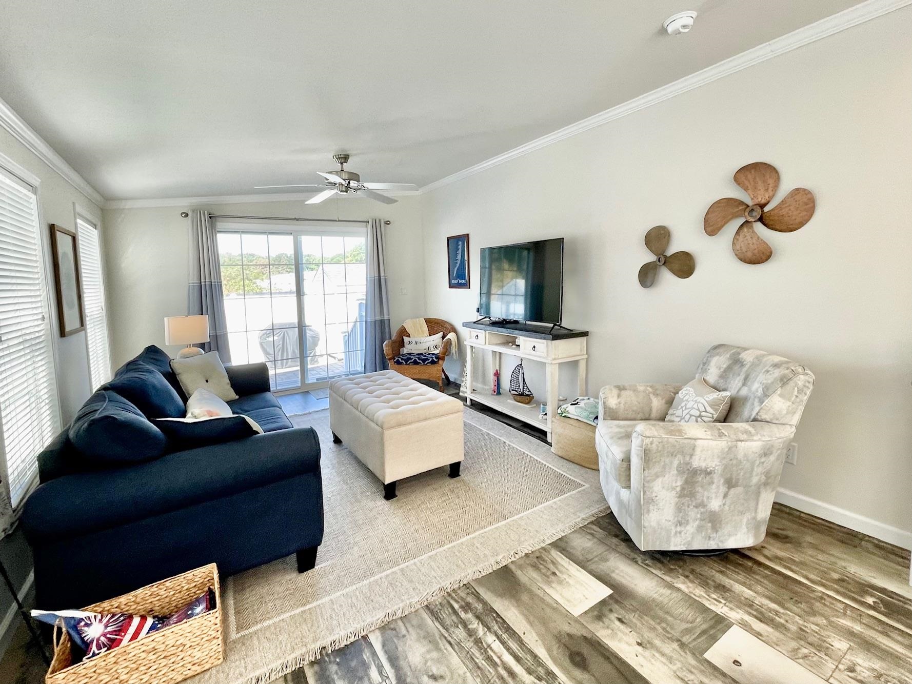 4100 Rte 9 South, Unit 84 Rio Grande, NJ 08242 - Photo 7 of 22 a living room with furniture and a flat screen tv