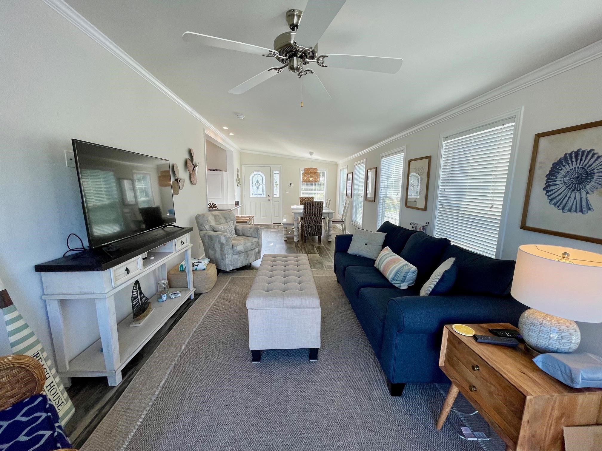 4100 Rte 9 South, Unit 84 Rio Grande, NJ 08242 - Photo 8 of 22 a living room with furniture and a flat screen tv