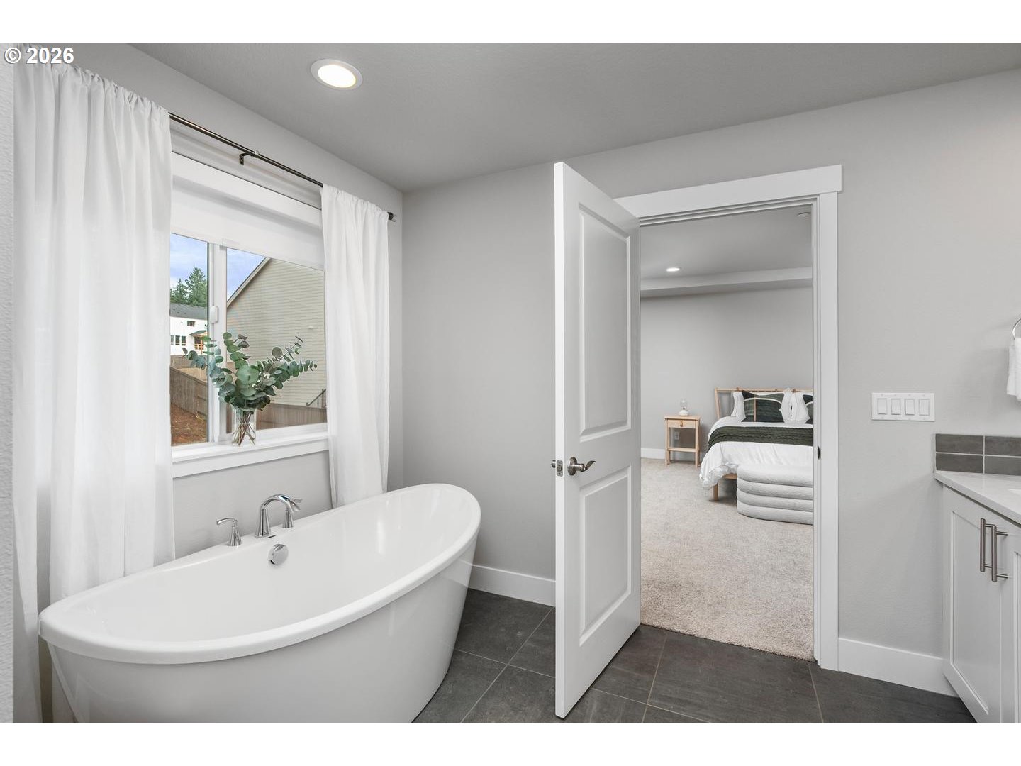 5489 North 91st Avenue Camas, WA 98607 - Photo 28 of 44 a bathroom with a sink a bathtub and a mirror