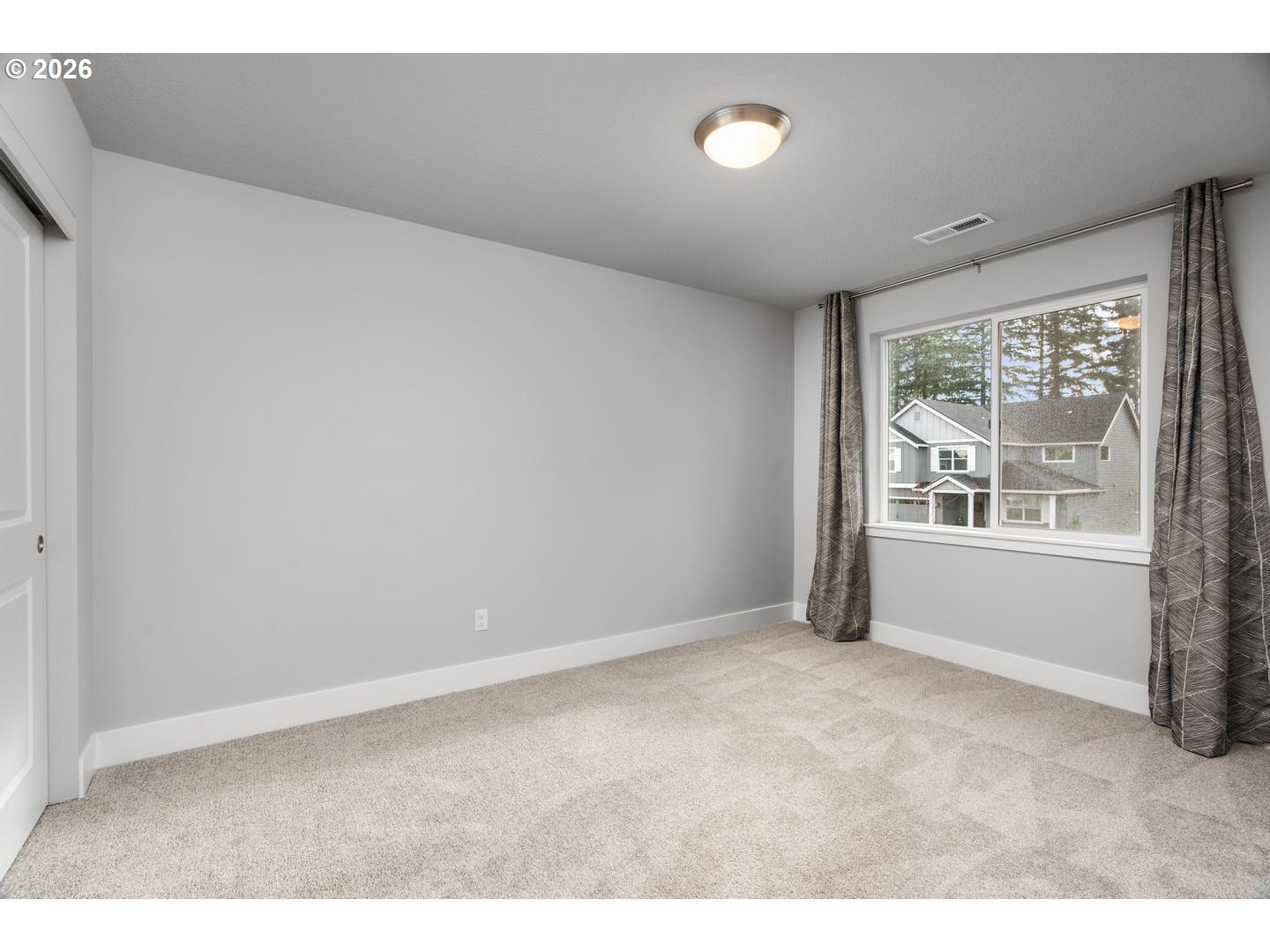 5489 North 91st Avenue Camas, WA 98607 - Photo 32 of 44 a view of an empty room with a window