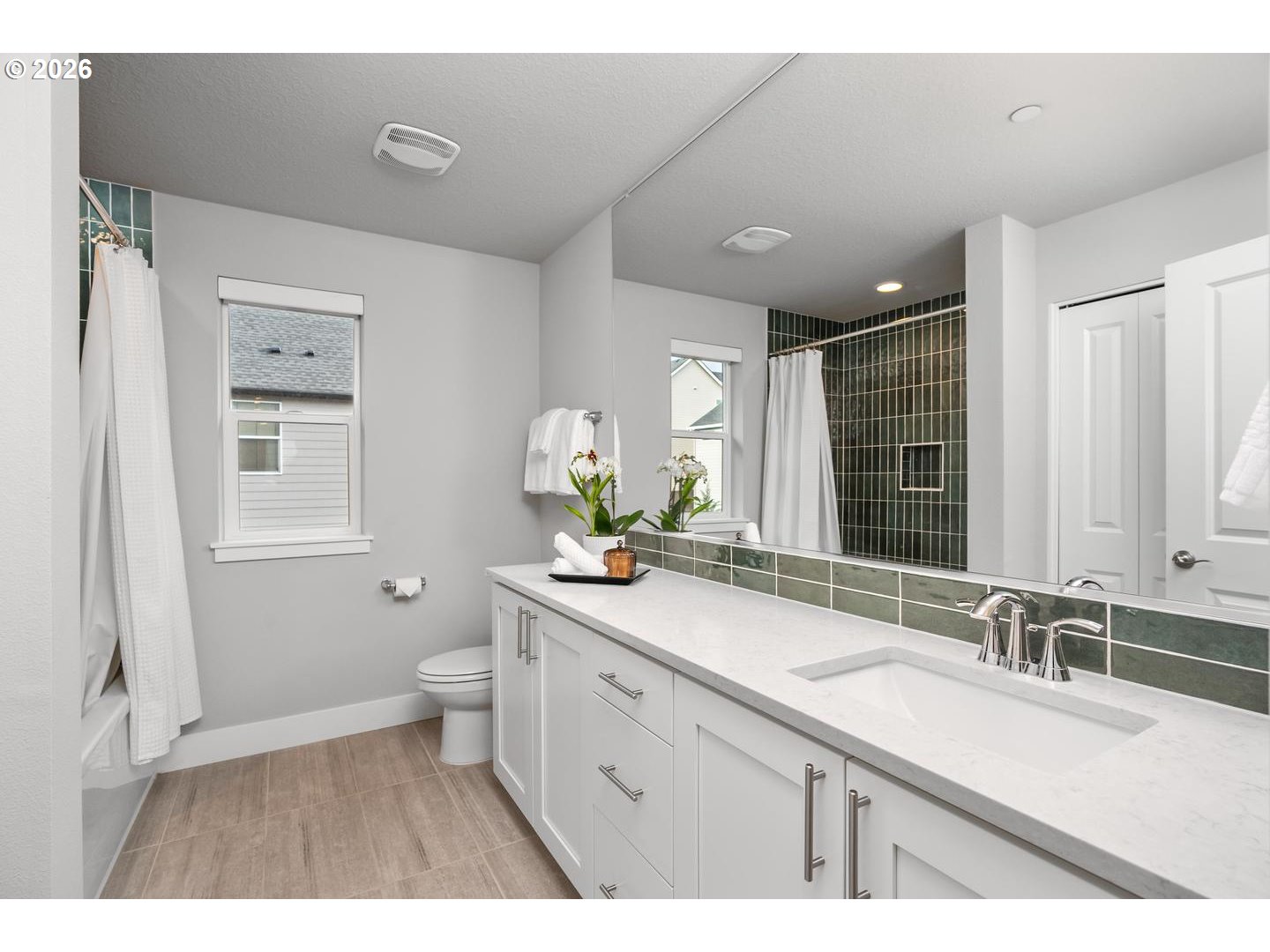5489 North 91st Avenue Camas, WA 98607 - Photo 33 of 44 a bathroom with a sink double vanity granite and a toilet