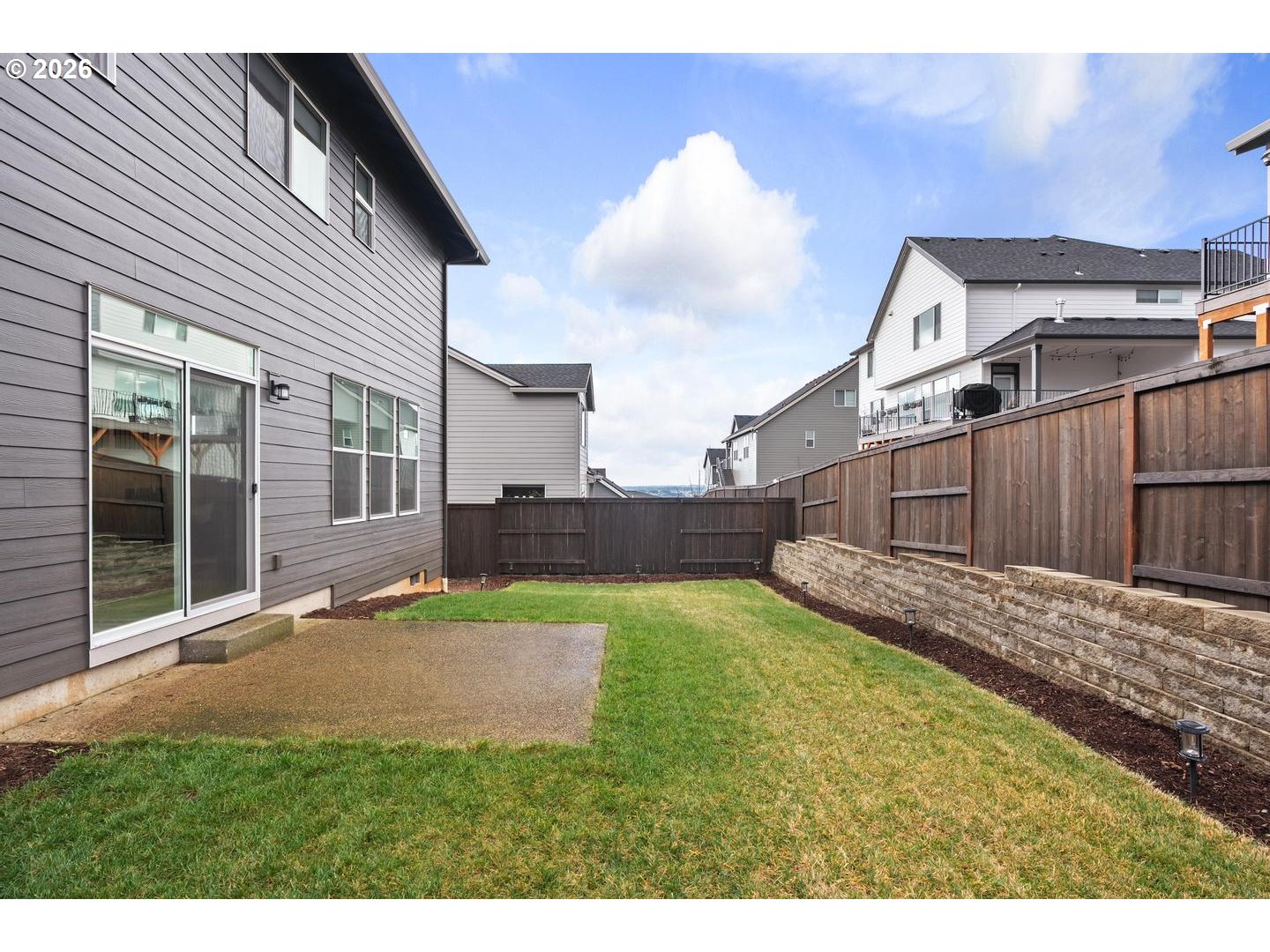 5489 North 91st Avenue Camas, WA 98607 - Photo 36 of 44 a view of a backyard with plants and a patio