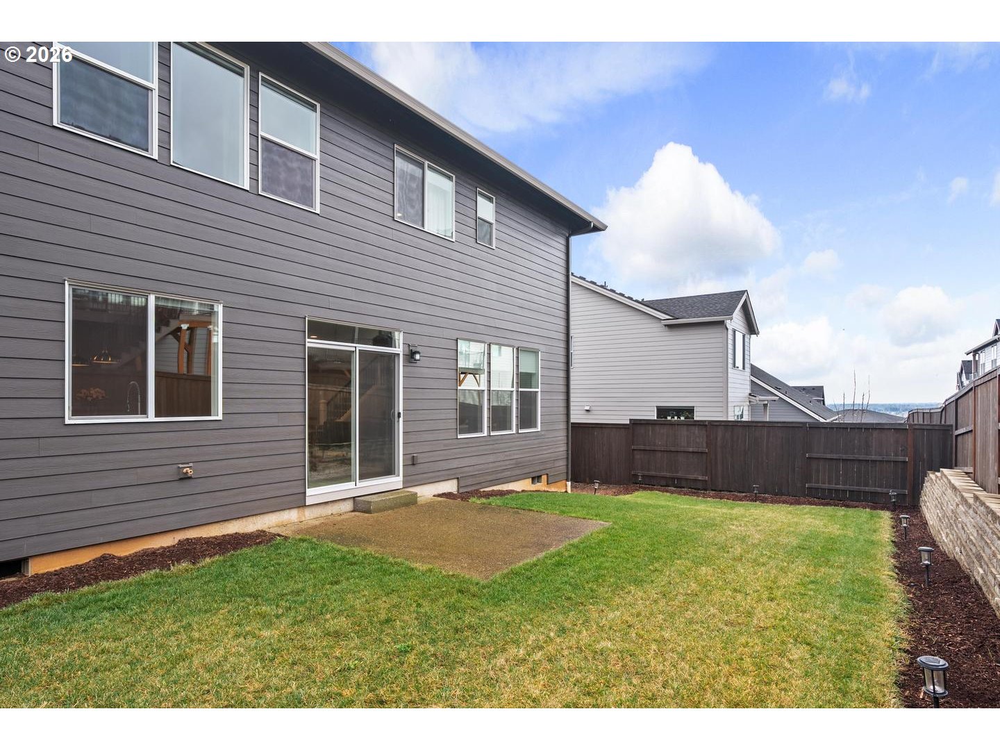 5489 North 91st Avenue Camas, WA 98607 - Photo 37 of 44 a view of a house with a yard and sitting area