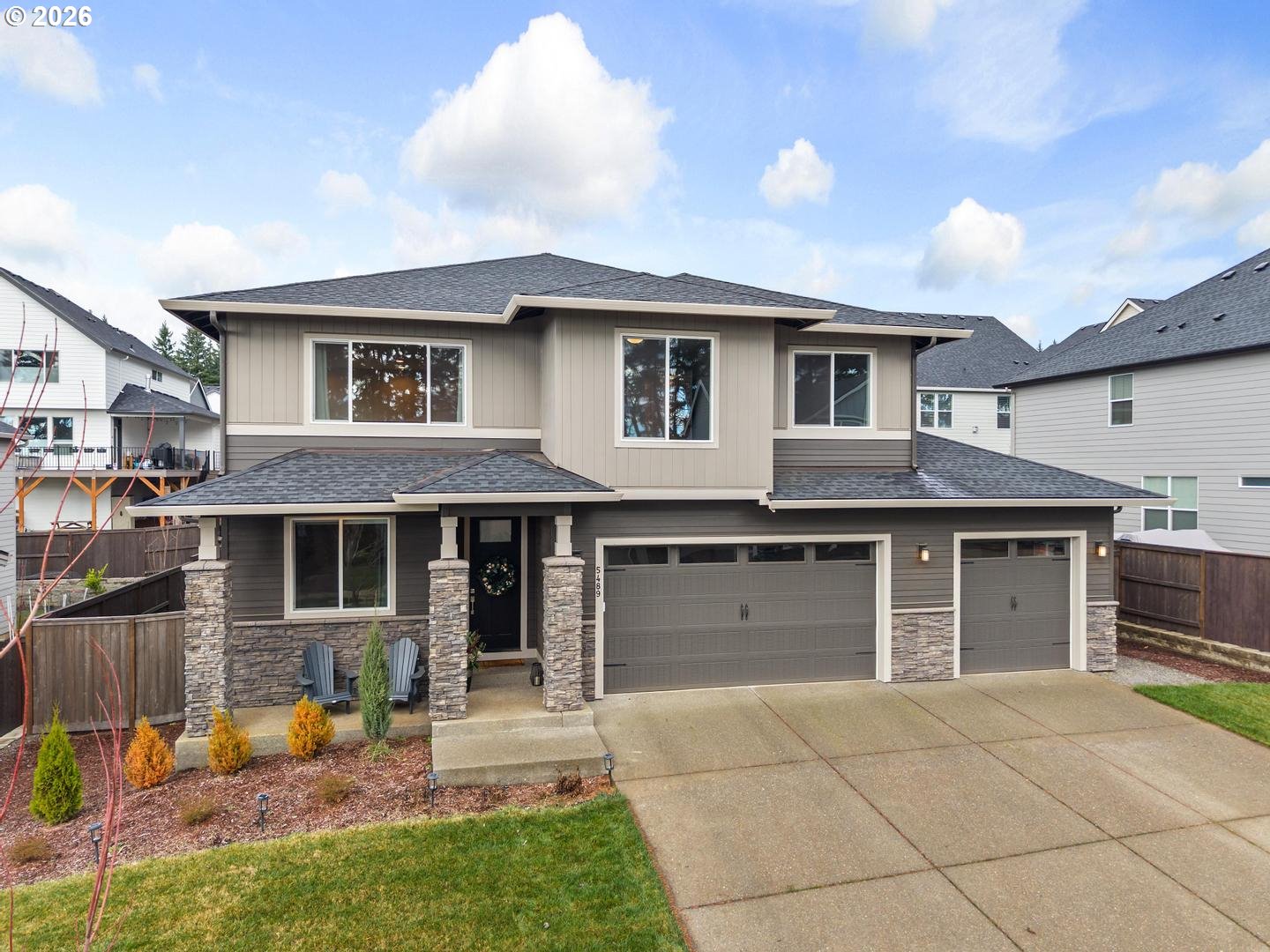 5489 North 91st Avenue Camas, WA 98607 - Photo 40 of 44 a front view of a house with a yard and garage