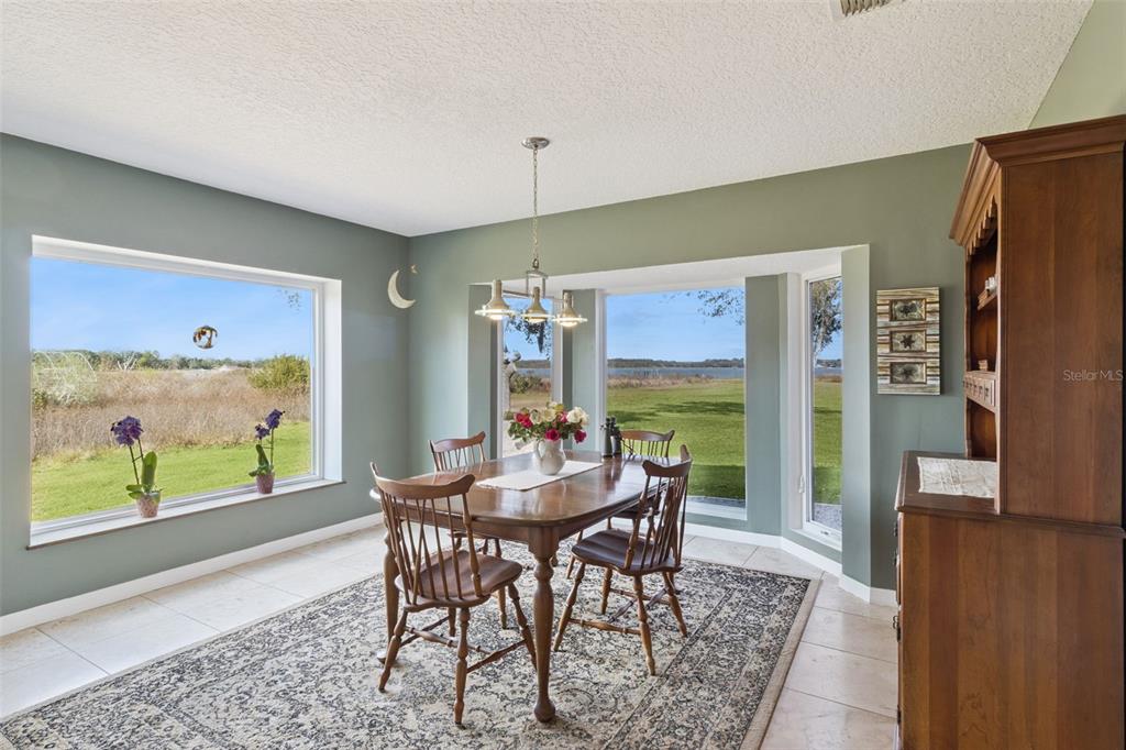 1256 Center Street Dundee, FL 33838 - Photo 12 of 41 a view of a dining room with furniture window and outside view