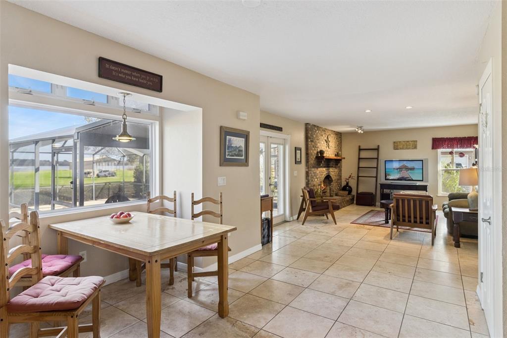 1256 Center Street Dundee, FL 33838 - Photo 12 of 41 a room with furniture a large window and a table