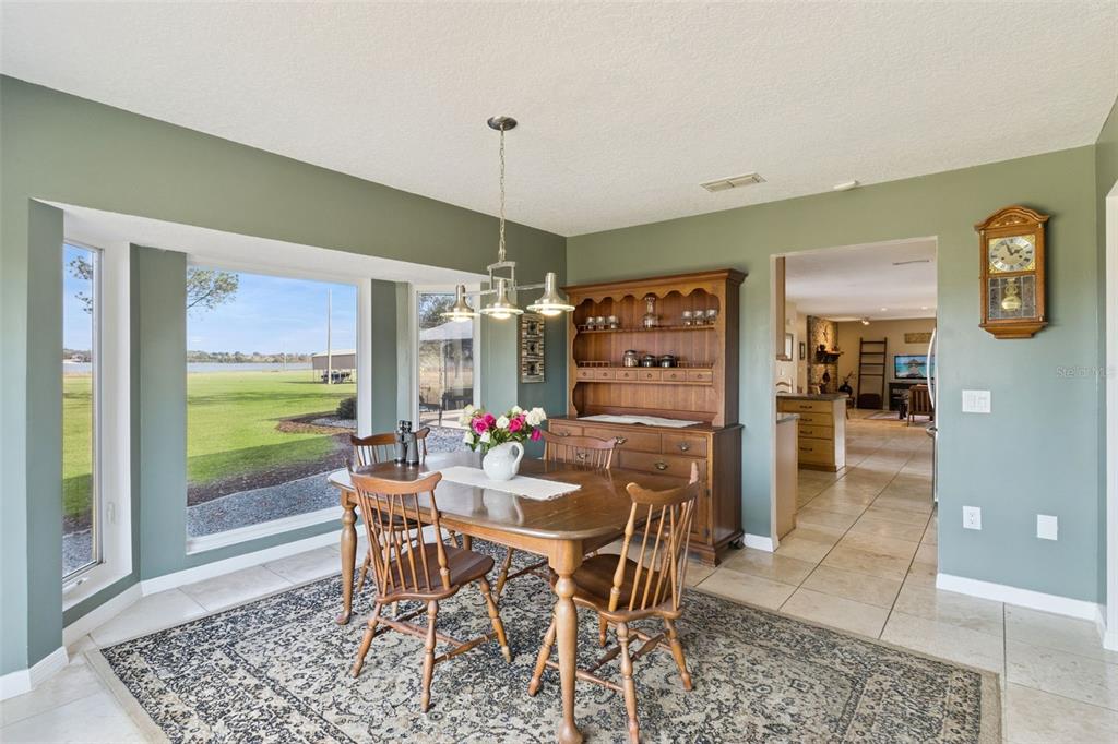 1256 Center Street Dundee, FL 33838 - Photo 15 of 41 a dining room with furniture and window