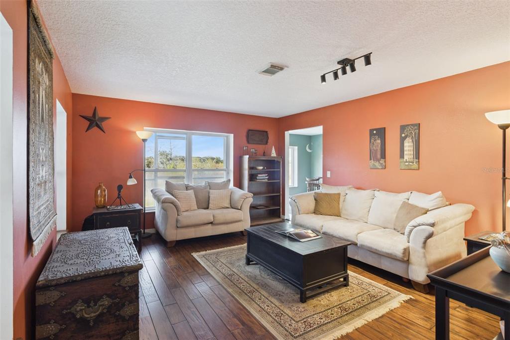 1256 Center Street Dundee, FL 33838 - Photo 15 of 41 a living room with furniture and a large window