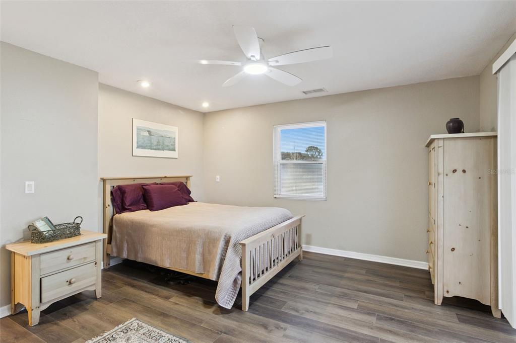 1256 Center Street Dundee, FL 33838 - Photo 20 of 41 a bedroom with a large bed and a window