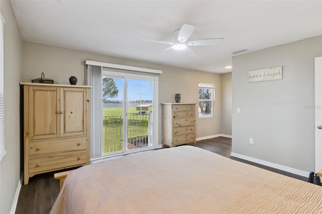 1256 Center Street Dundee, FL 33838 - Photo 21 of 41 a bedroom with a bed and cabinets
