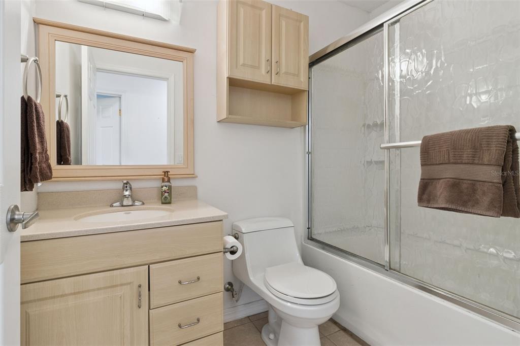 1256 Center Street Dundee, FL 33838 - Photo 26 of 41 a bathroom with a sink toilet and shower