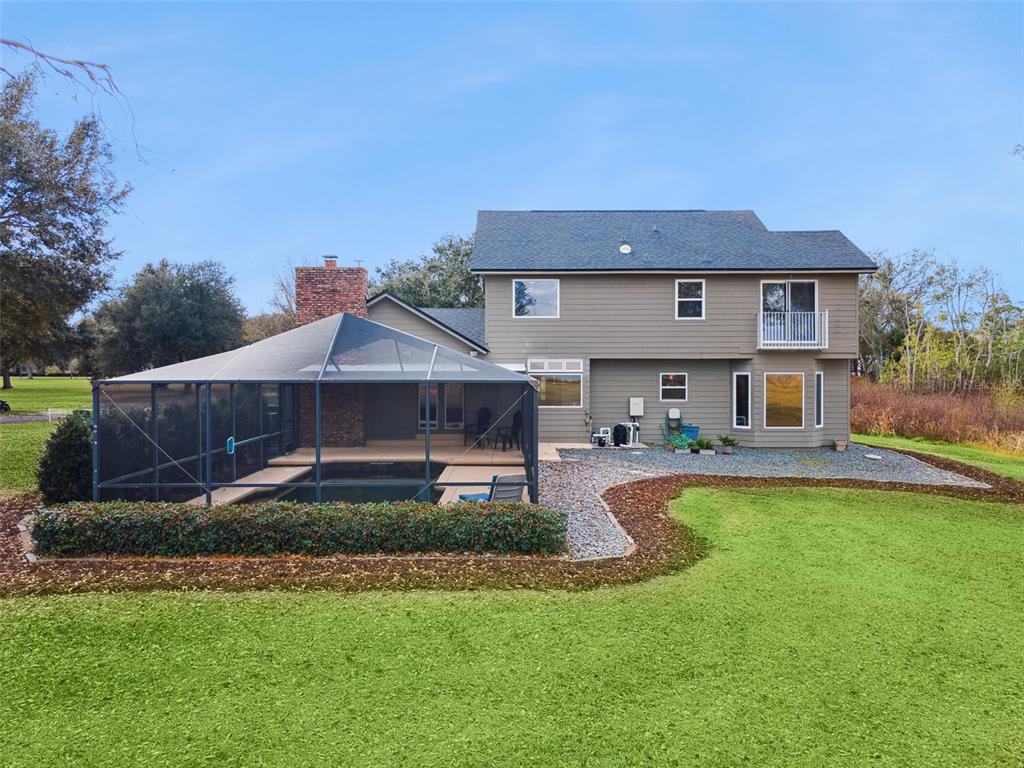 1256 Center Street Dundee, FL 33838 - Photo 33 of 41 a front view of a house with a yard table and chairs