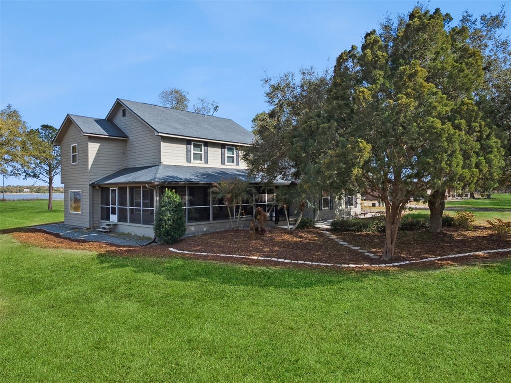 1256 Center Street Dundee, FL 33838 - Photo 35 of 41 a view of a house with a yard porch and sitting area