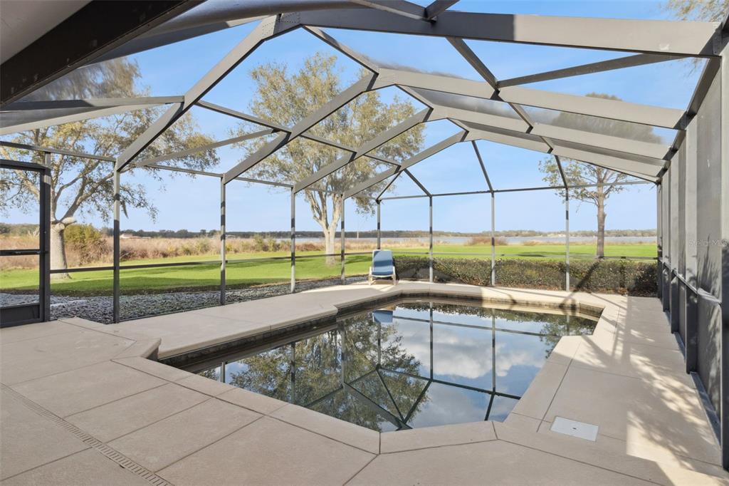 1256 Center Street Dundee, FL 33838 - Photo 5 of 41 a view of a swimming pool with a backyard