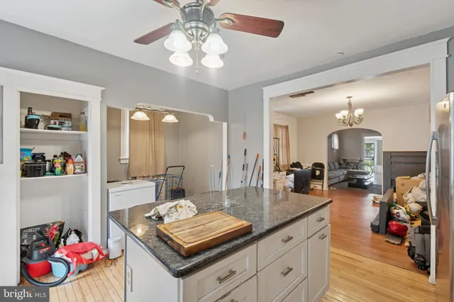 a view of a kitchen area kitchen island dining table and chairs