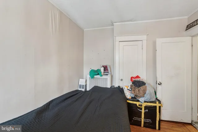 a bed room with a bed and a window