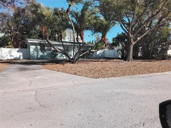 a view of a trees in front of a house