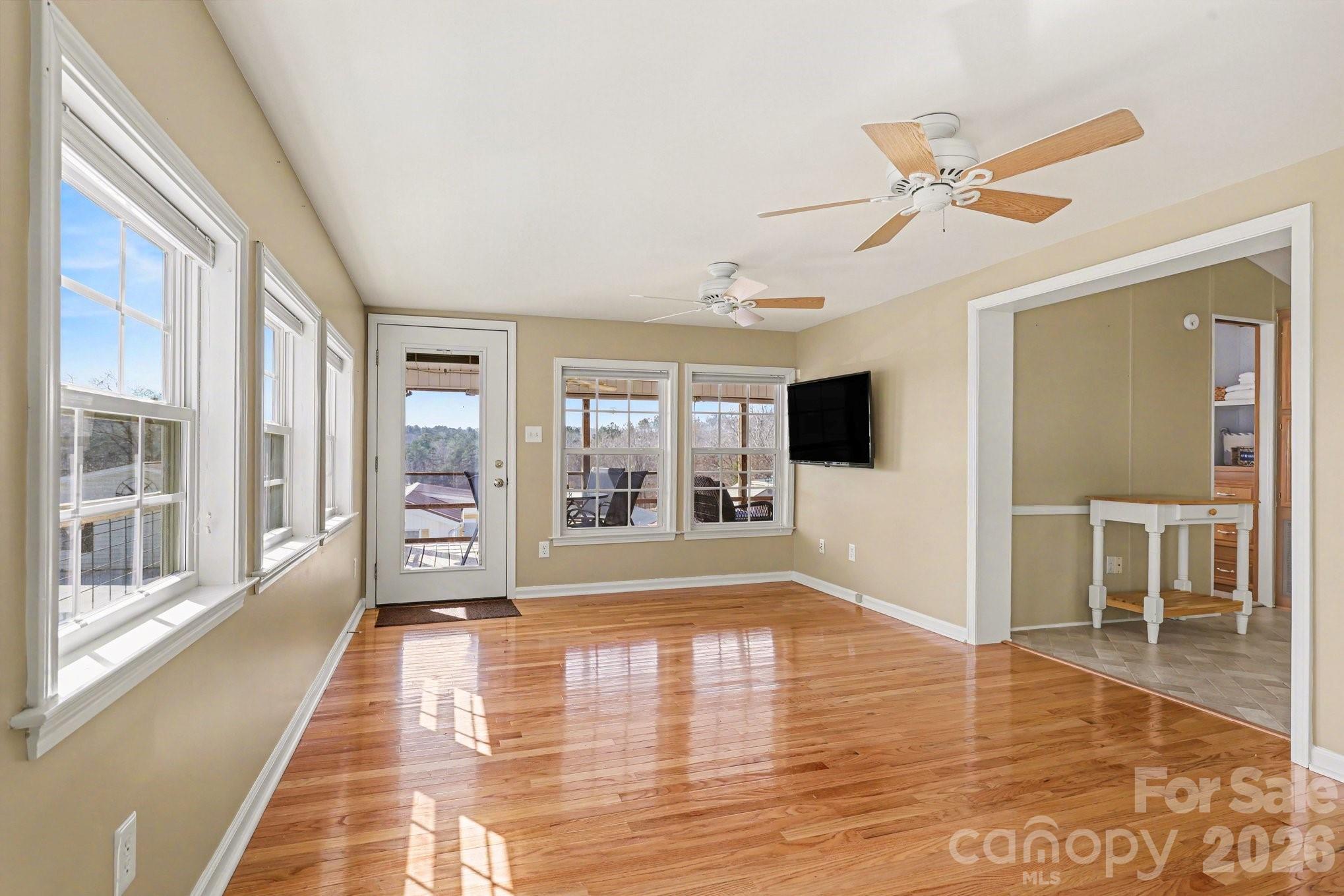 122 Maple Street New London, NC 28127 - Photo 4 of 29 a view of a livingroom with wooden floor and furniture