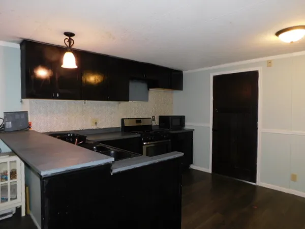 a kitchen with a sink and cabinets