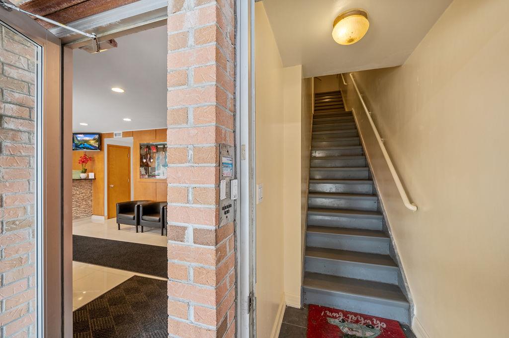 43-07 162nd Street Queens, NY 11358 - Photo 16 of 18 Stairs with recessed lighting