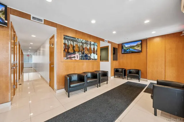 a lobby with furniture and outdoor view