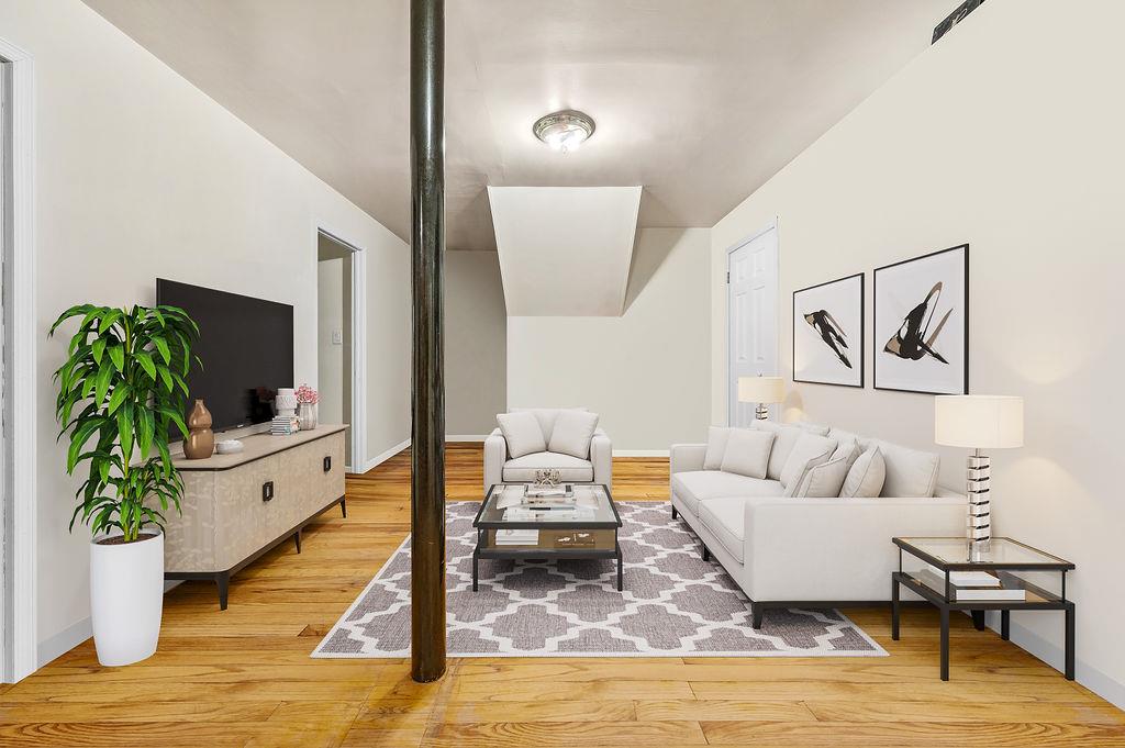 43-07 162nd Street Queens, NY 11358 - Photo 8 of 18 Living area with baseboards and wood finished floors