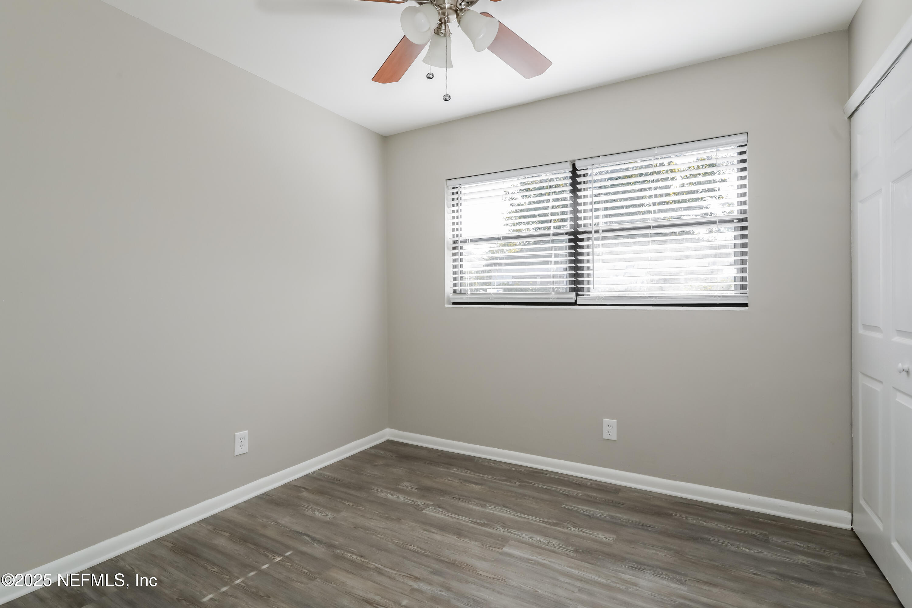7428 Centauri Road Jacksonville, FL 32210 - Photo 11 of 15 an empty room with a window