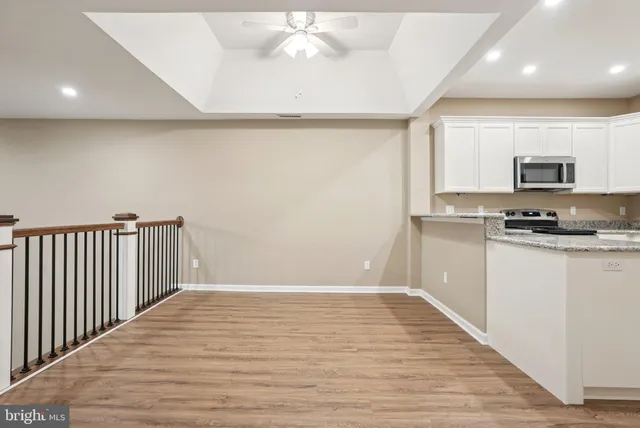 a view of a hallway with a chandelier