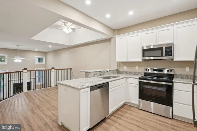 a view of a kitchen from the hallway