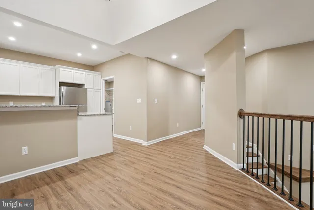 a kitchen with a refrigerator sink and microwave