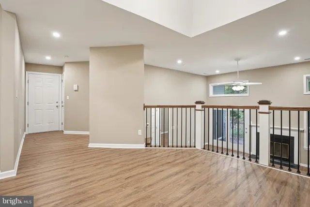 a kitchen with a sink and a mirror