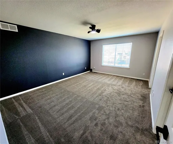 a view of empty room with windows