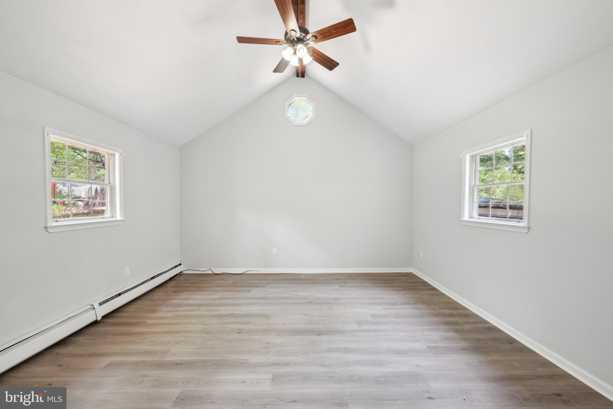 47 Lakeview Drive Tabernacle, NJ 08088 - Photo 13 of 25 an empty room with wooden floor ceiling fan and windows