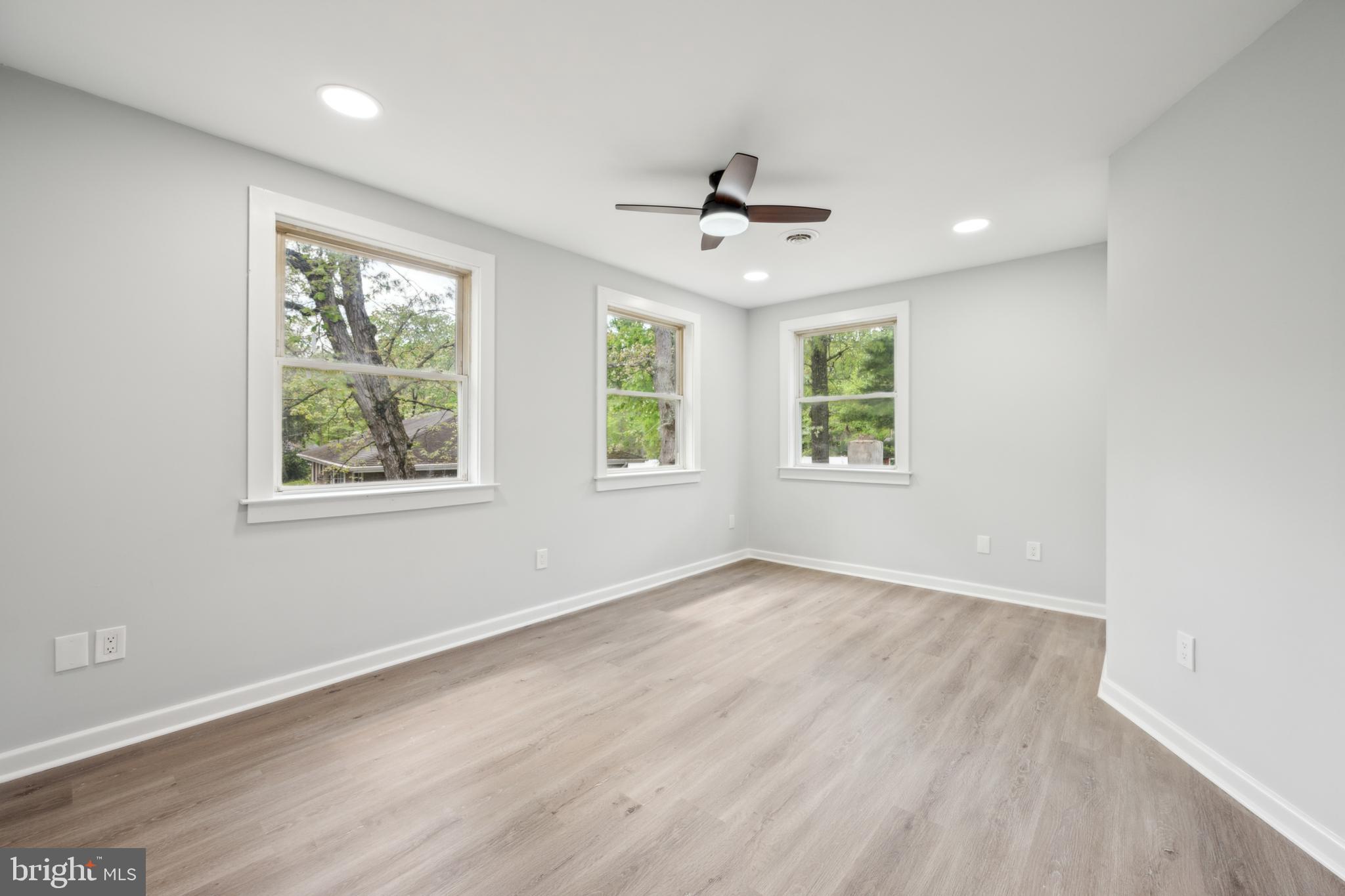 47 Lakeview Drive Tabernacle, NJ 08088 - Photo 16 of 25 a view of an empty room with a window and wooden floor