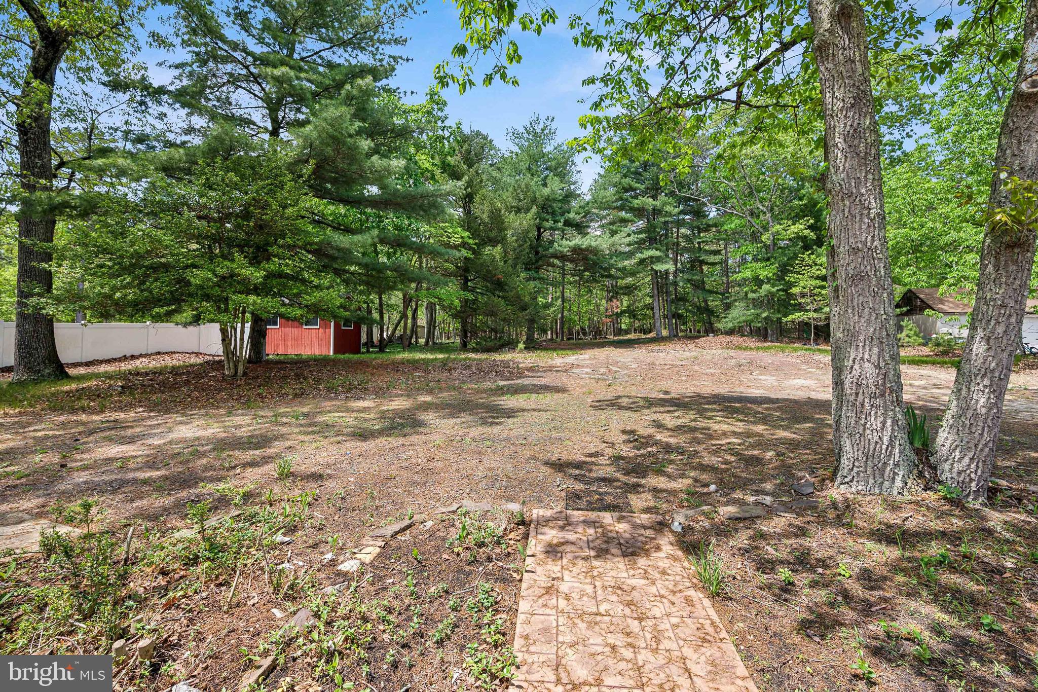 47 Lakeview Drive Tabernacle, NJ 08088 - Photo 22 of 25 a view of a yard with plants and trees