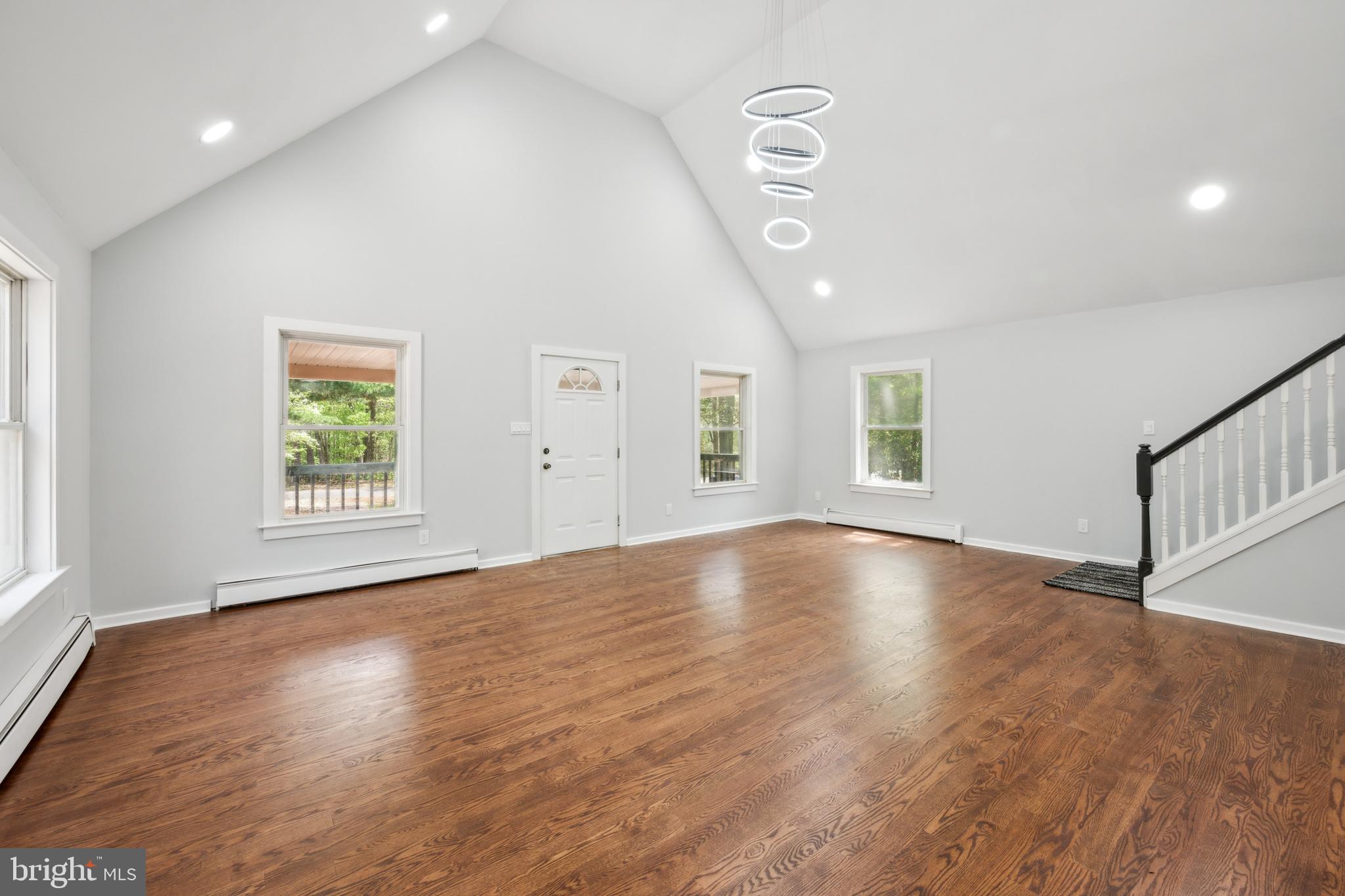 47 Lakeview Drive Tabernacle, NJ 08088 - Photo 9 of 25 an empty room with wooden floor and windows