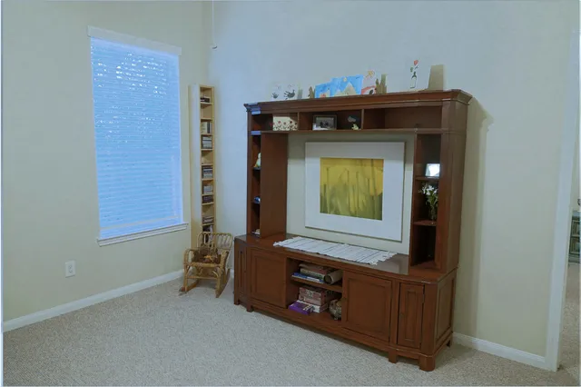a view of gym equipment and windows