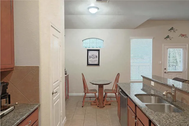 a view of a hallway with seating area