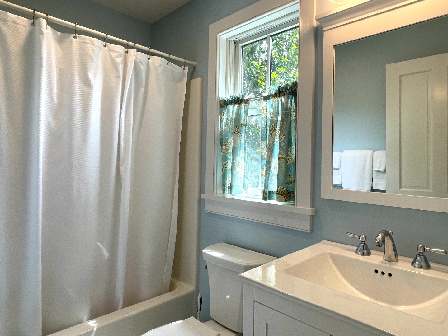 155 Surfside Road Nantucket, MA 02554 - Photo 28 of 60 a bathroom with a sink and a mirror