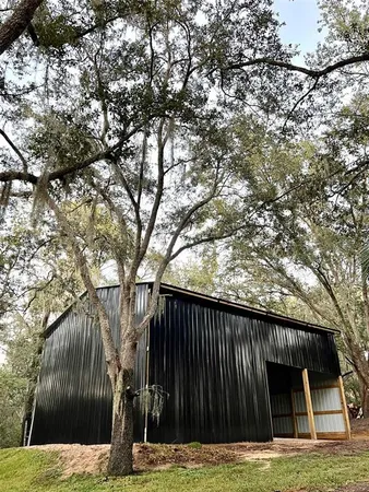 a house with trees in the background