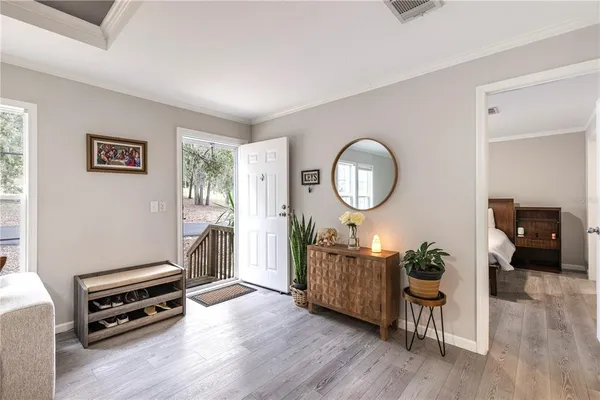 a bedroom with a bed and a mirror